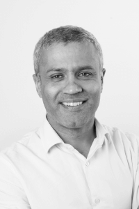 Black and white portrait photo of Pooran Desai